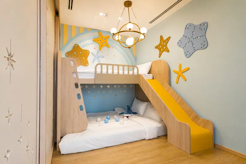 Children's bunk room with a yellow slide