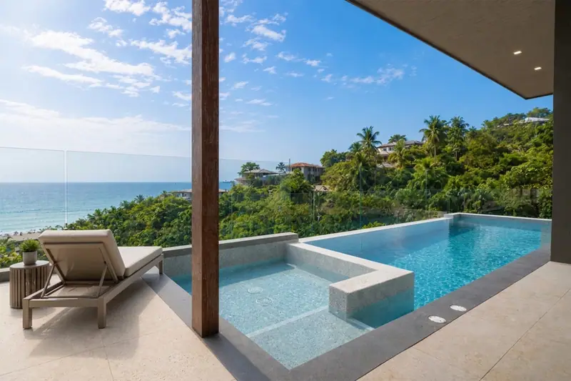 Private pool above the sea on a bright afternoon