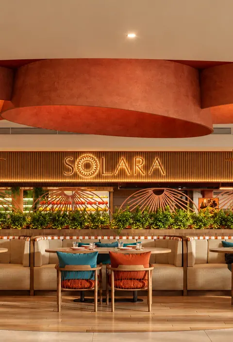 Solara restaurant with terracotta canopies and lantern light